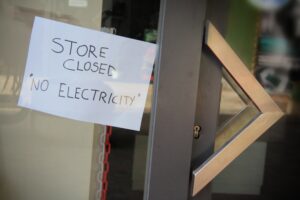 generators for power outages - closed store sign in window - california 